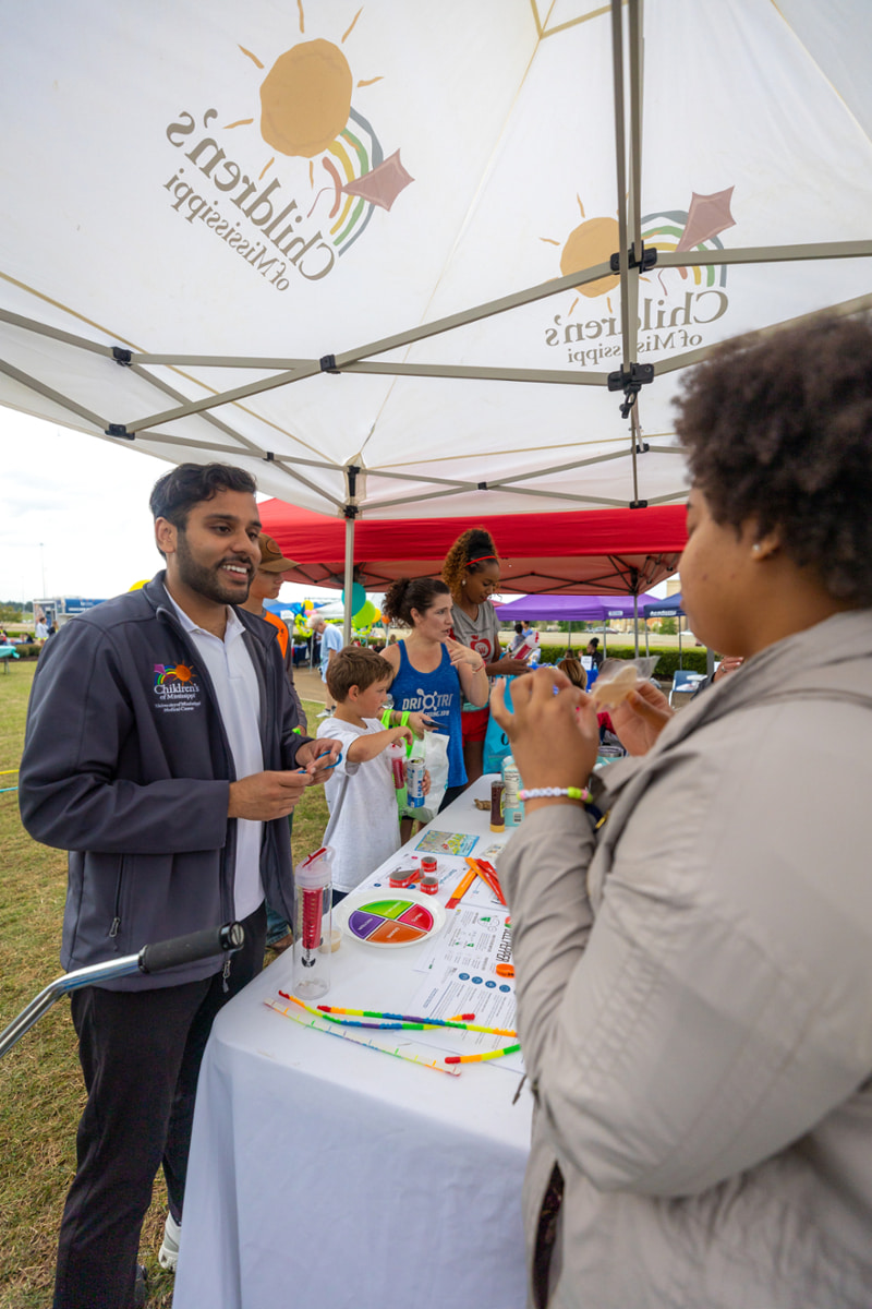 Attendees conversing at the Children's Tent.